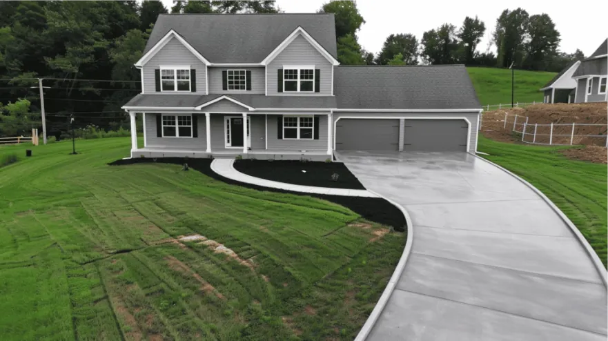 Professional concrete driveway installation showcasing precision engineering and detailed planning